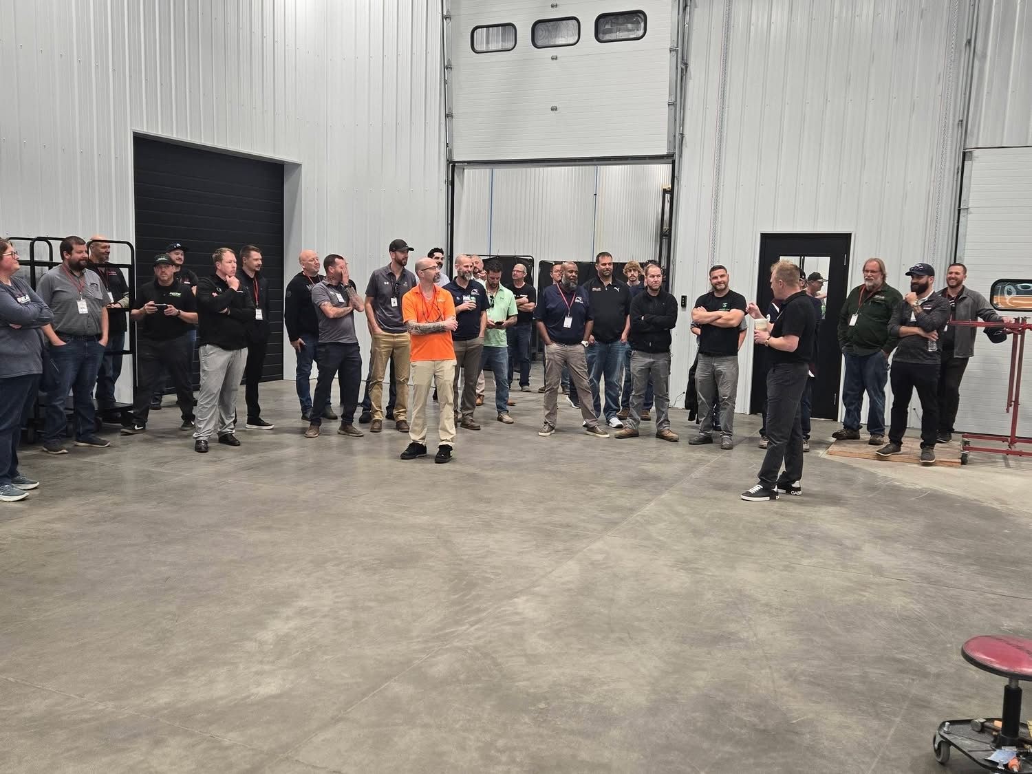 Attendees gathered in the America's Most Wanted 4x4 shop during the facility tour